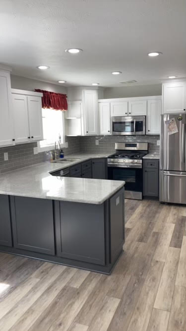 Picture of a kitchen in Idaho Falls after the remodel, Wooden Cabinets repainted